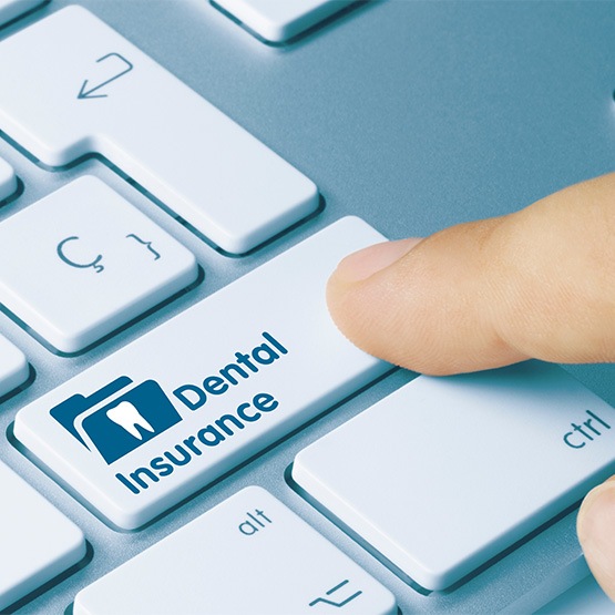 Up-close view of a keyboard with dental insurance button