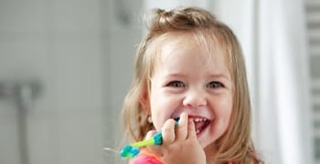 little girl with toothbrush 