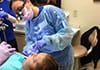 Dr. Boyd working with dental patient