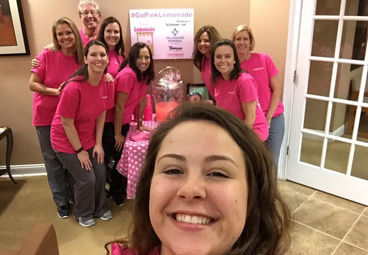 Dental team posing with Go Pink Lemonade