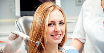 A young female patient smiles in preparation for a regular checkup and cleaning in Tallahassee