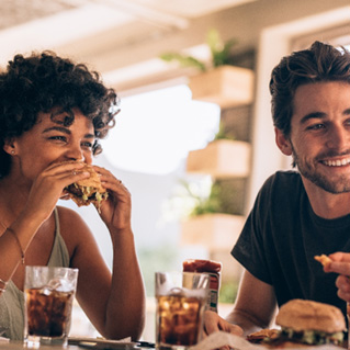 Group of friends enjoying meal in restaurant