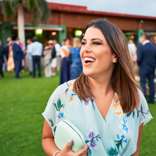 Woman smiling outside at wedding