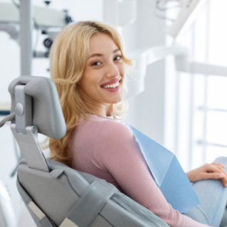 Closeup of smiling patient sitting in treatment chair