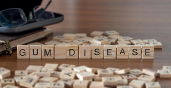 Scrabble tiles spelling Gum Disease in Tallahassee