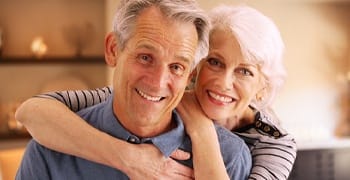 older couple hugging and smiling