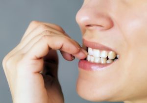 person biting their nails