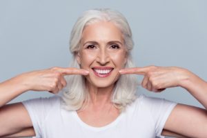 Older woman with dental implants in Tallahassee.