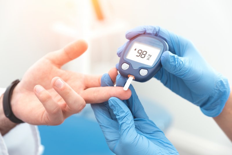 doctor checking blood sugar levels